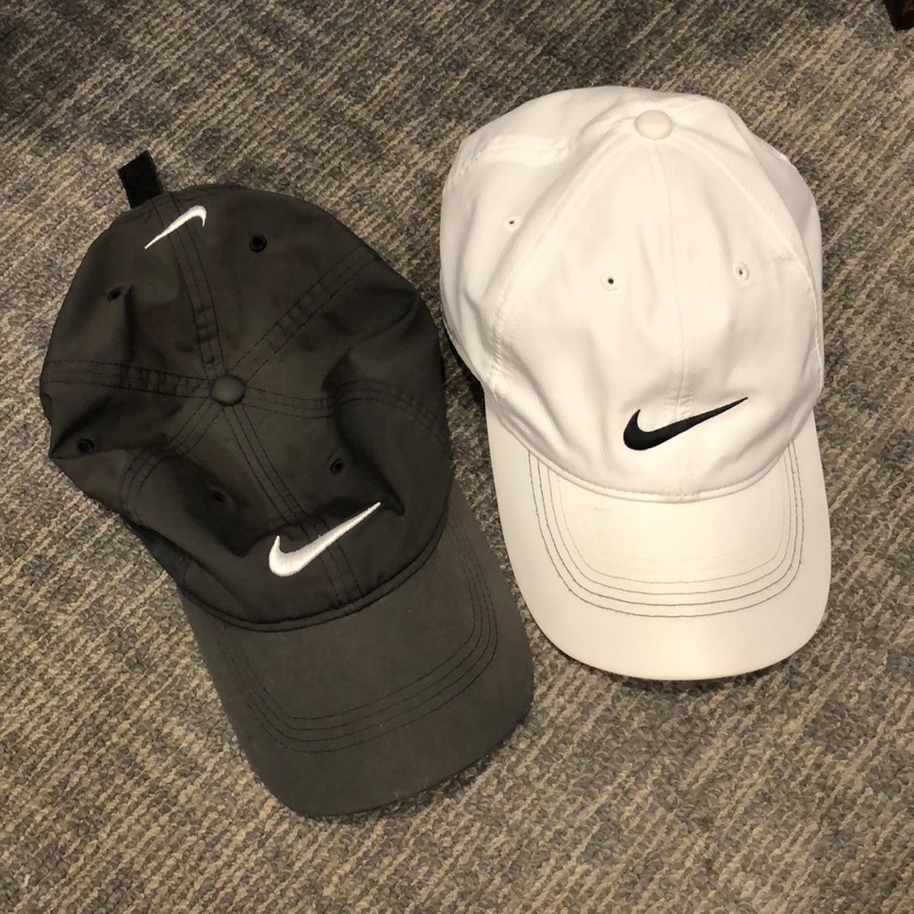 Two Nike golf caps